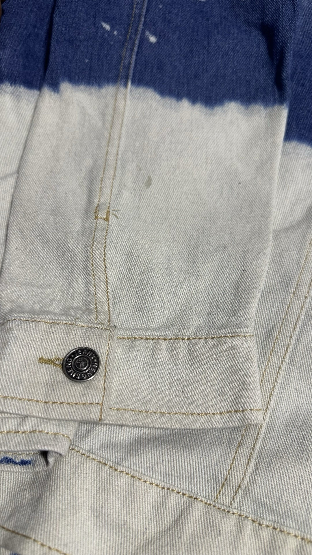 Bleached two-toned denim jacket. Distressed